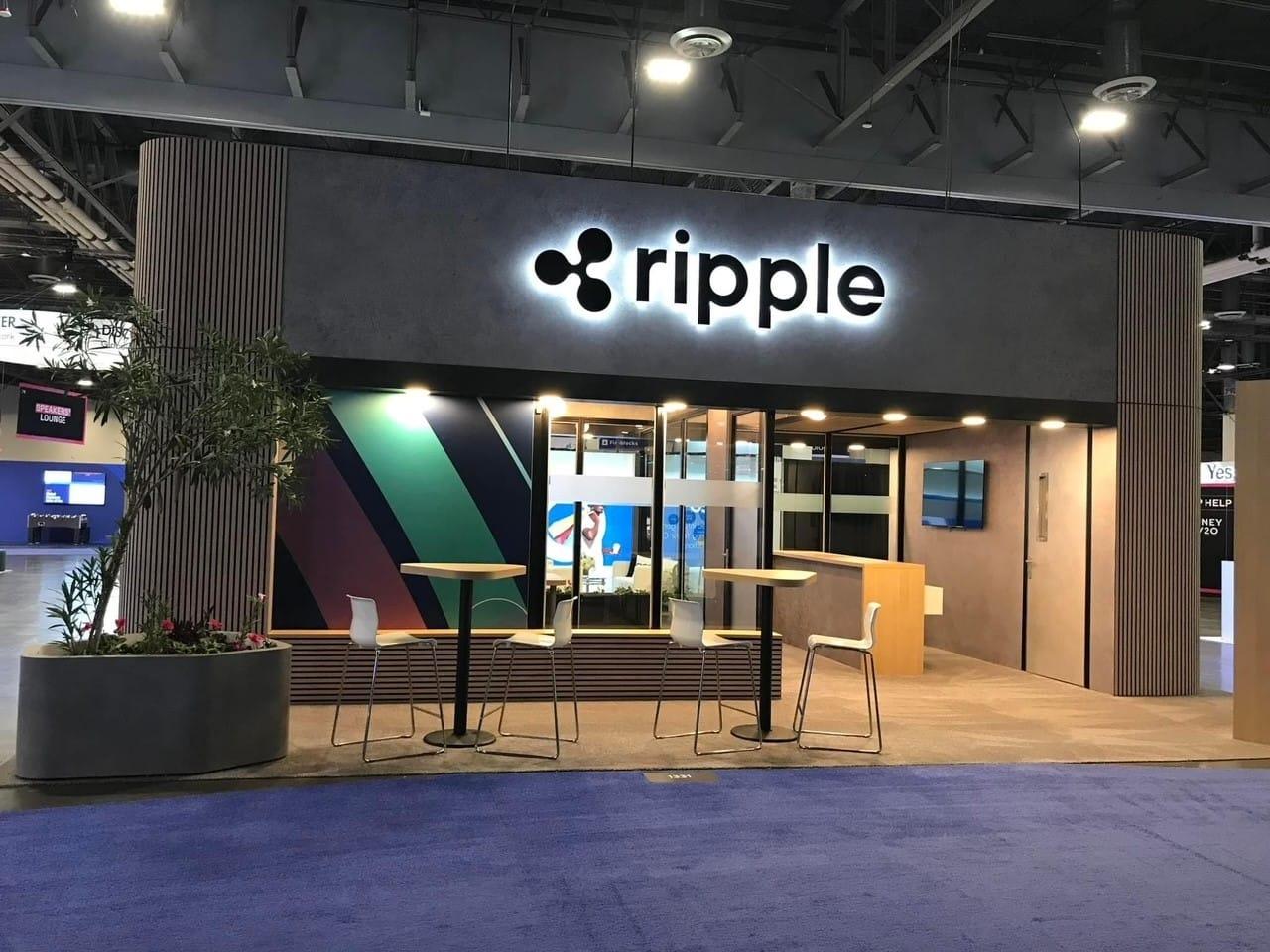 Entrance to Ripple office with modern design and logo.
