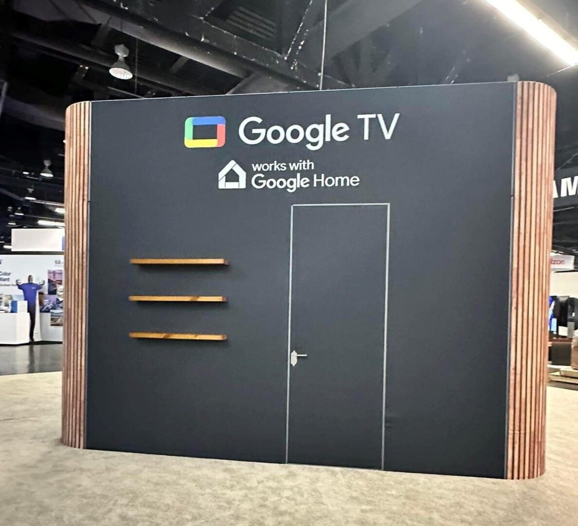 Google TV display booth with closed double doors at an event.