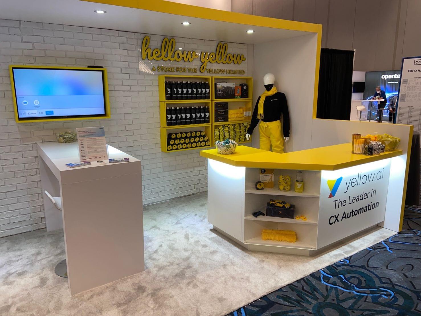 Yellow.ai trade show booth with mannequin