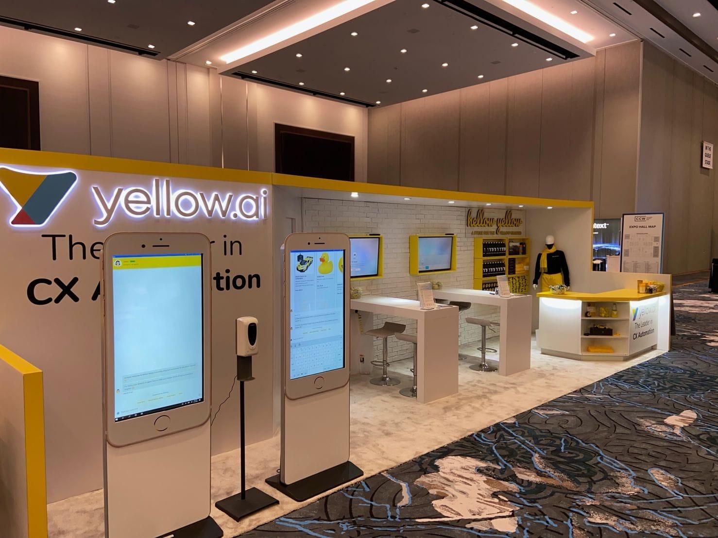 Yellow.ai trade show booth with interactive displays